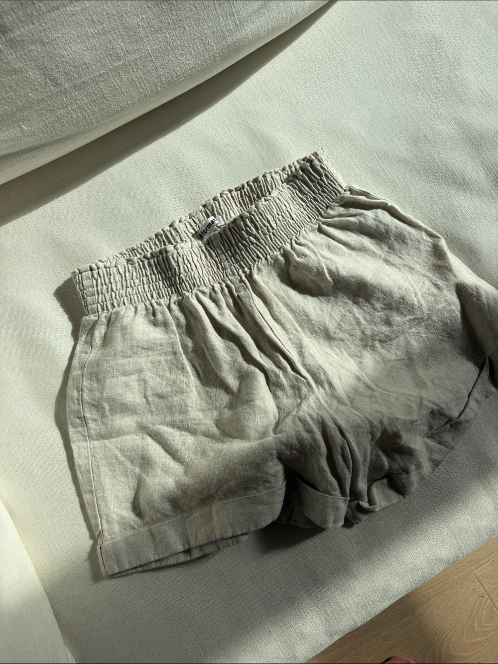 Reformation Cream High-Waist Smocked Linen Shorts